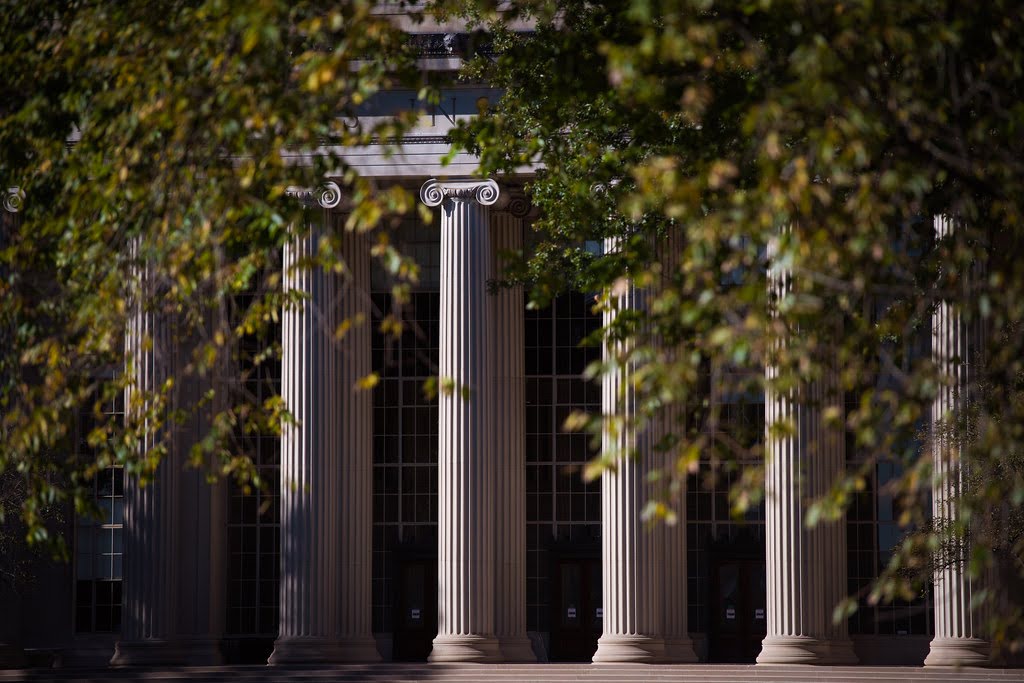 MIT campus with trees and Ionic columns